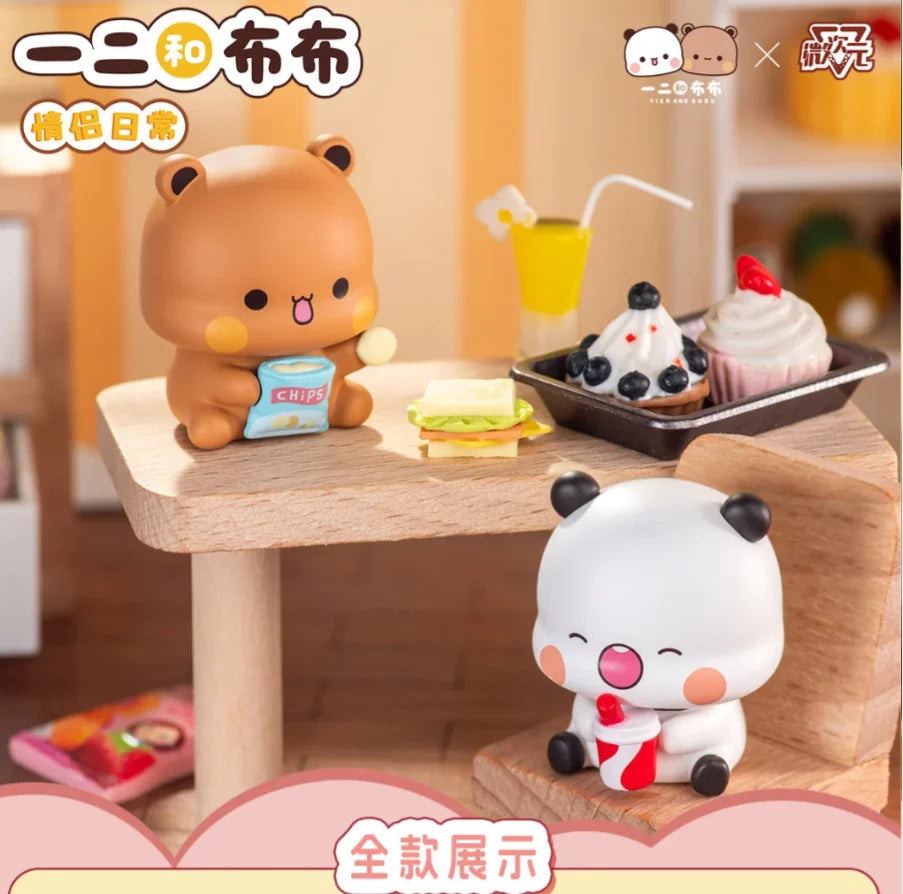 Bubu and Dudu mini figures at a snack table