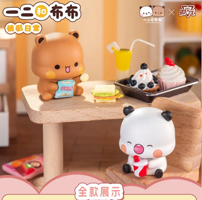 Bubu and Dudu mini figures at a snack table