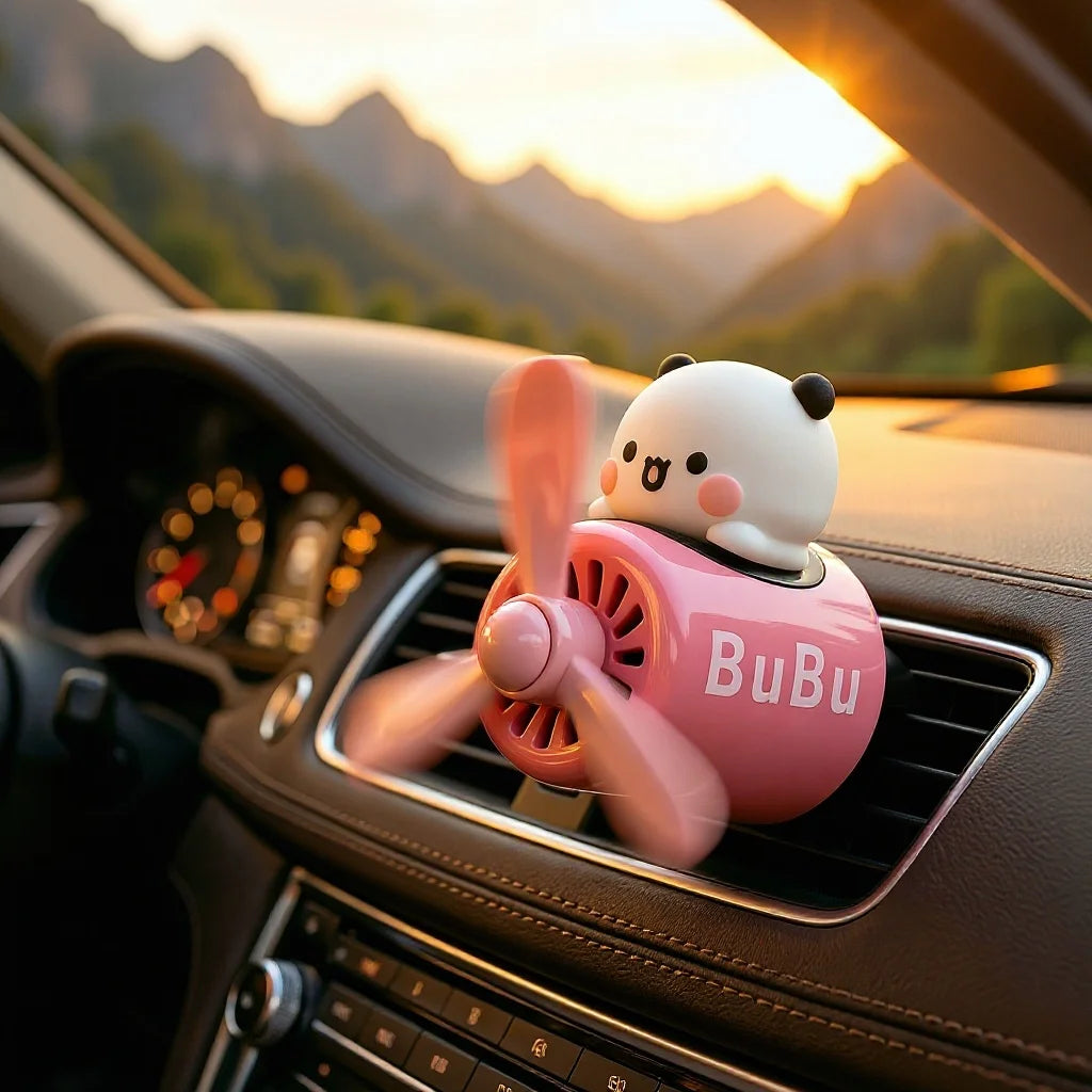 Bubu and Dudu airplane car air freshener on a dashboard vent