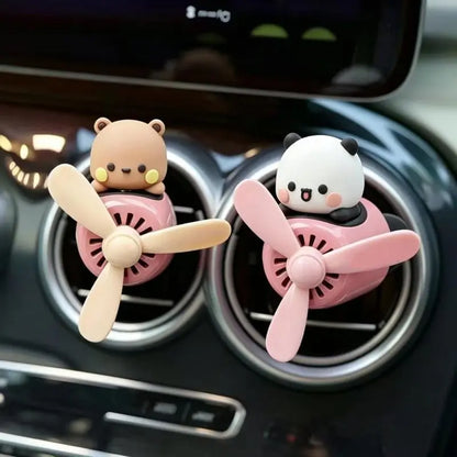 Bear and panda airplane air fresheners on car vents